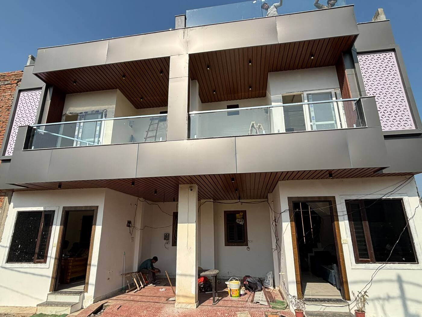 Front of two duplex villas with balconies