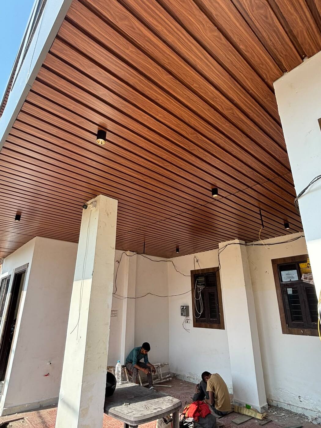 Wood-finish porch ceiling with spot lights
